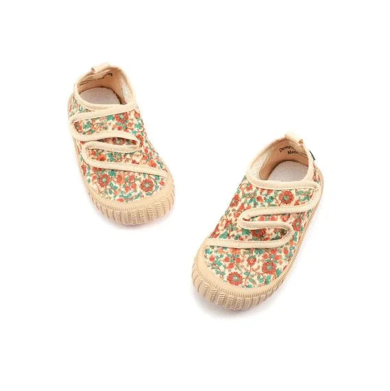 Pair of floral-patterned baby shoes on a white background